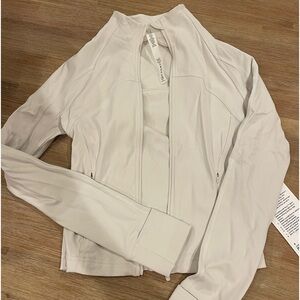 Lululemon Nulu Cropped Define Jacket in the color Bone size 4
